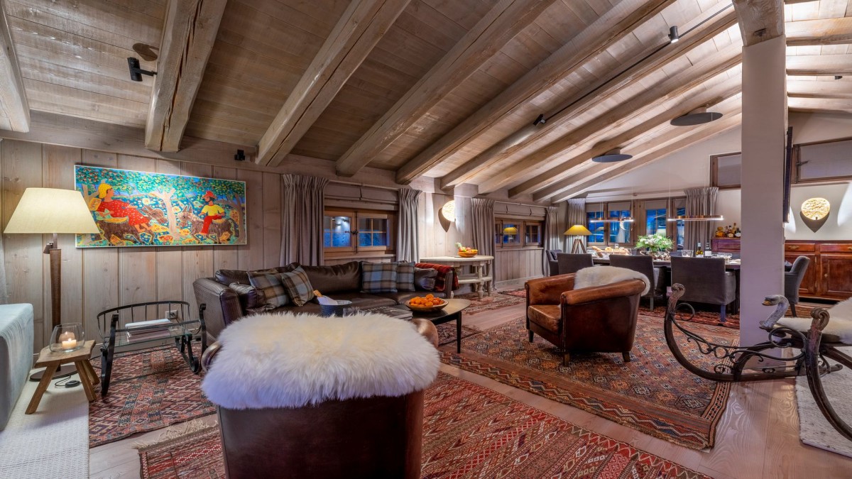Duplex Apartment Breithorn, Verbier. Comfy sofas and armchairs provide space to relax in a rustic atmosphere