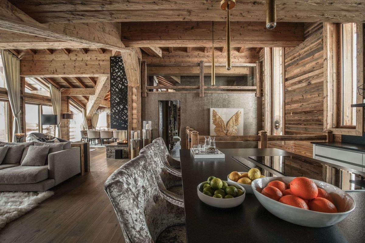 All areas in chalet Infinity – pictured the living/dining room – enjoying breathtaking views of the Chamonix valley from large windows. Access to the furnished sun terrace via the luxuriously designed living room