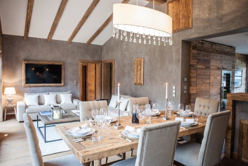 Main living area with dining table at Apartment Holunder – one of Chalet Kitz’ three apartments