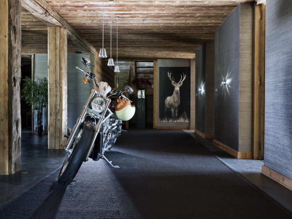 Chalet One Oak’s entrance hall with motorcycle Chalet One Oak’s entrance hall with motorcycle
