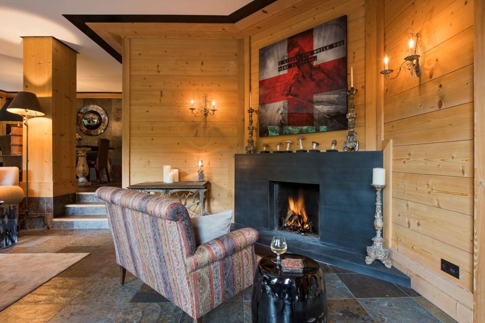 Chalet Aflabim, Gstaad, Swiss Alps – pictured here are the main living room with open fireplace on the first floor