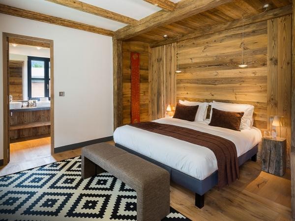 Chalet Shar Pei sleeps 10 in four double bedrooms – shown here is the Master bedroom with en-suite bathroomWe are happy to assist at any time to find your Luxury Ski Chalet worldwide for winter/ski holidays you’ll never forget