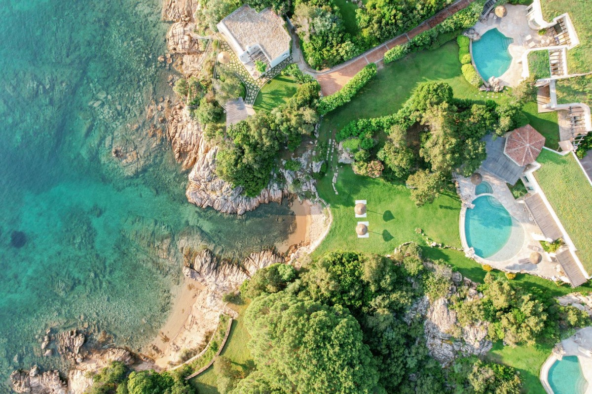 Aerial view of three private villas at Hotel Pitrizza with private pools and beach access