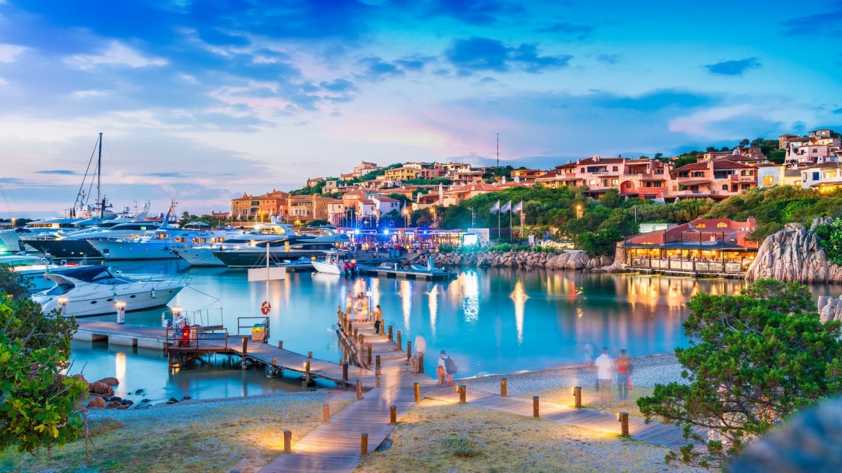 The Marina of Porto Cervo, adorned with luxurious yachts, is surrounded by an array of villas, restaurants, hotels, and opulent residences.